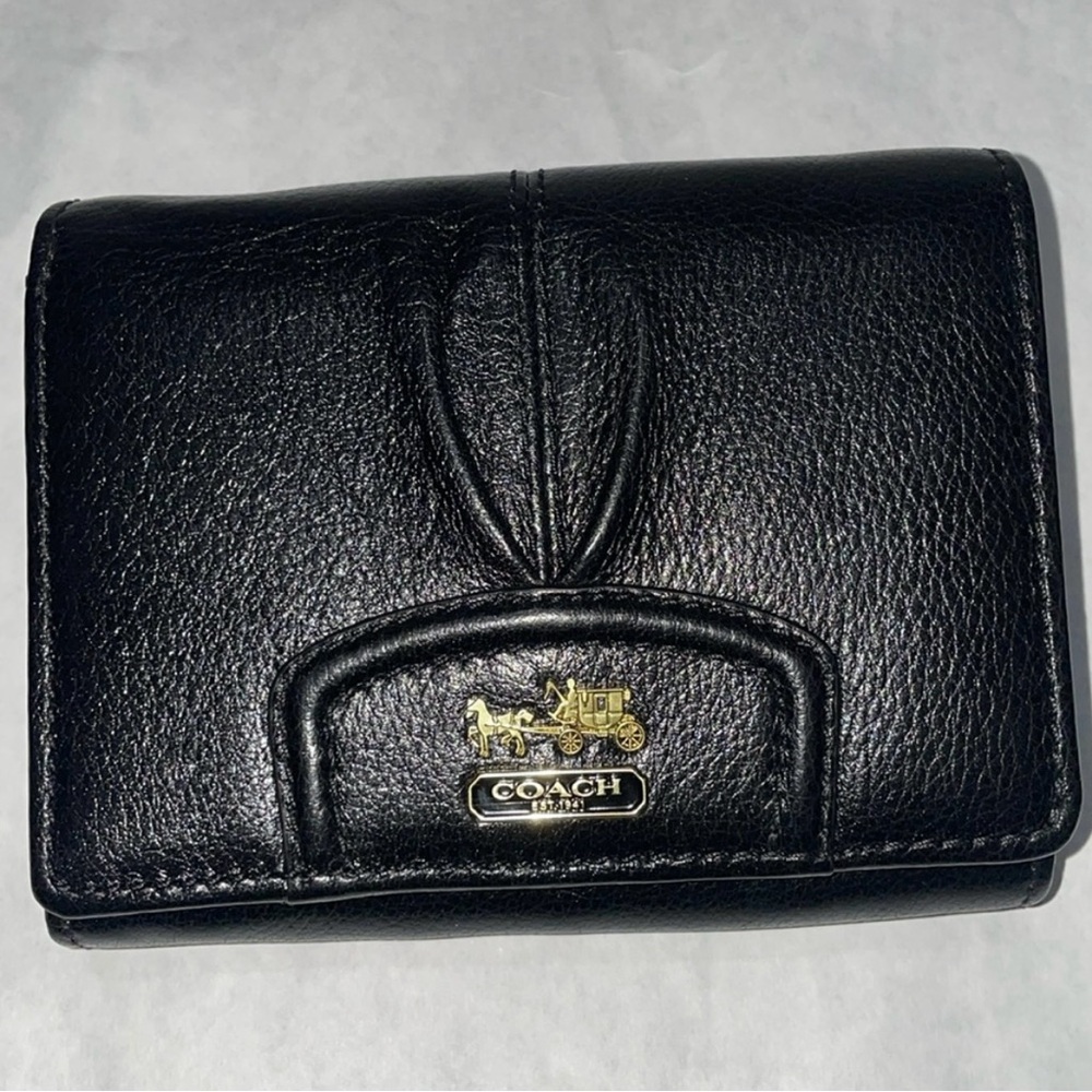 Vintage Coach black leather tri-fold wallet.
